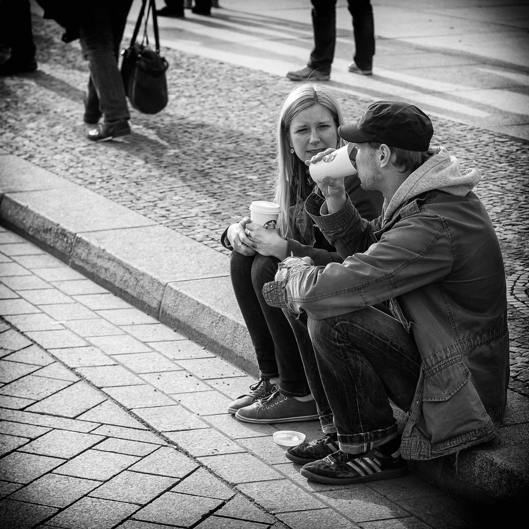 two people talking on the street