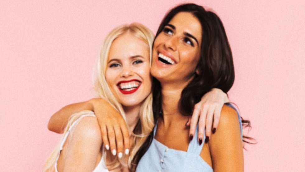 two smiling laughing best college girl friends