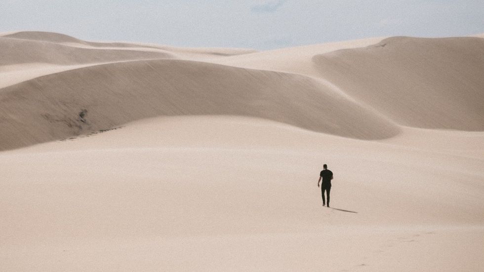 walking alone in desert mental health concept