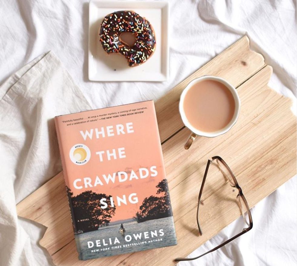 "Where the Crawdads Sing" with coffee and doughnut