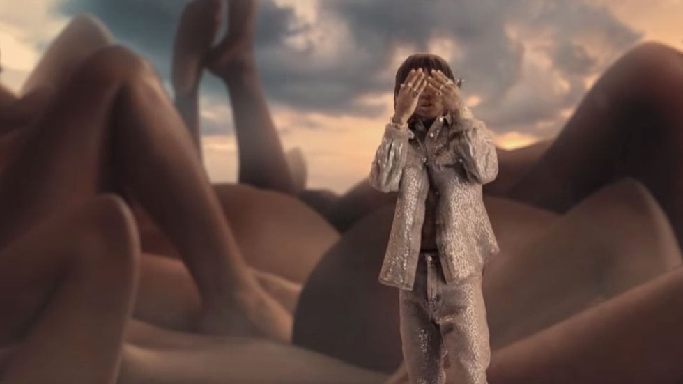 wiz khalifa photo in front of tree at park