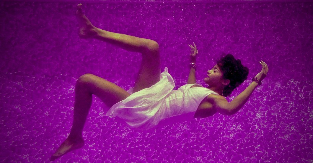 woman falling on purple surface
