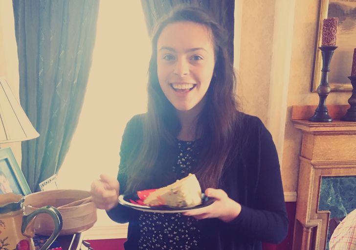 Woman happily eats cake at age 19