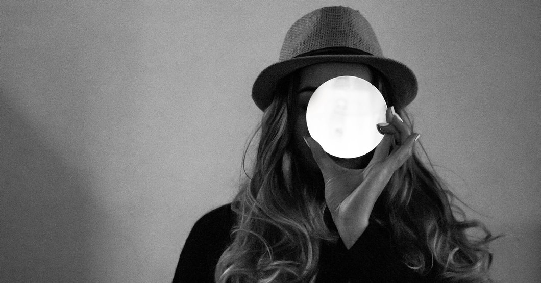 woman in black shirt wearing black hat