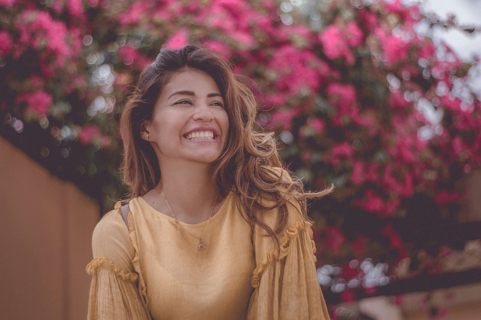 woman laughing in april during spring time