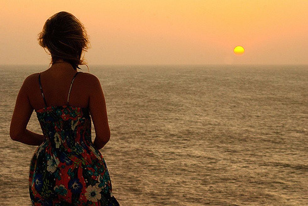 woman looking at sunset