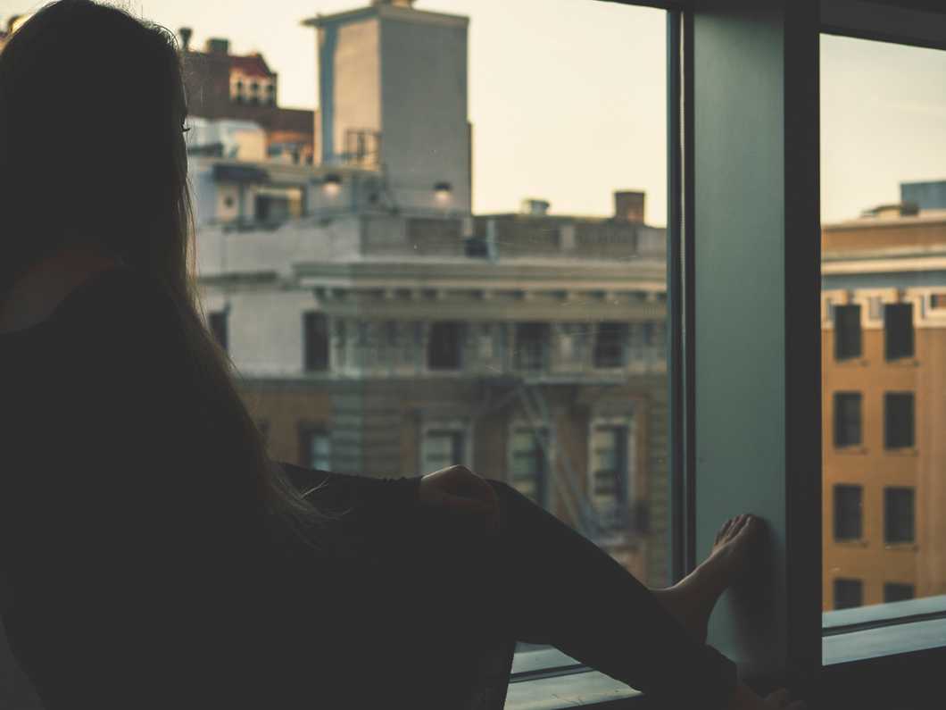 Woman looking out a window
