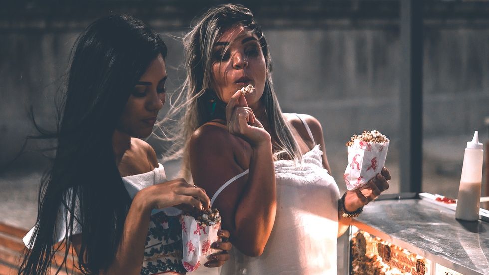 woman looking out at water on the beach