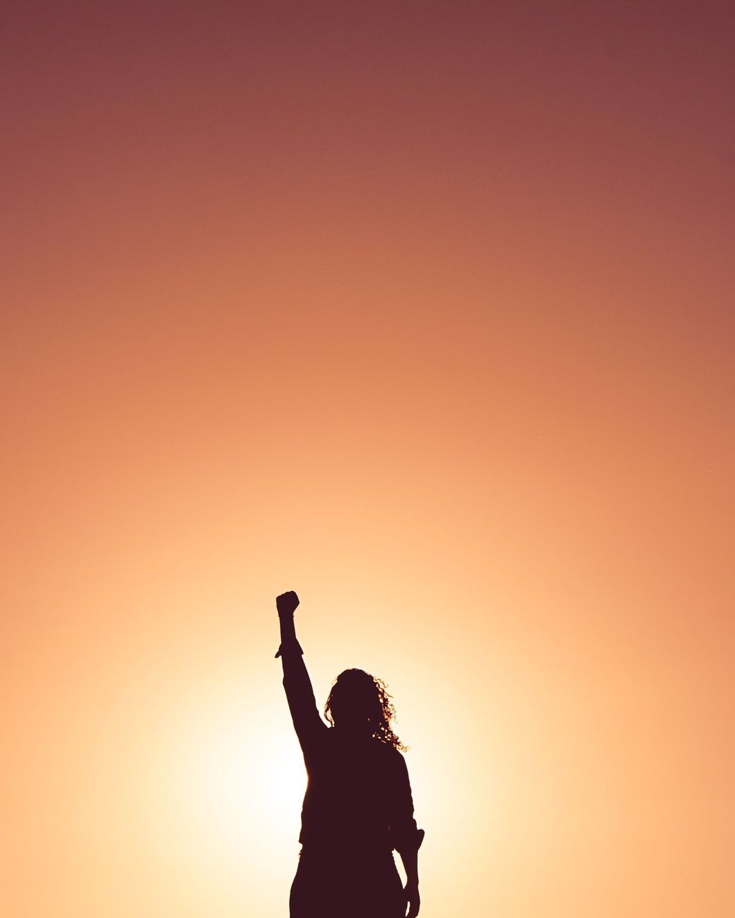 Woman raising her fist to the sky