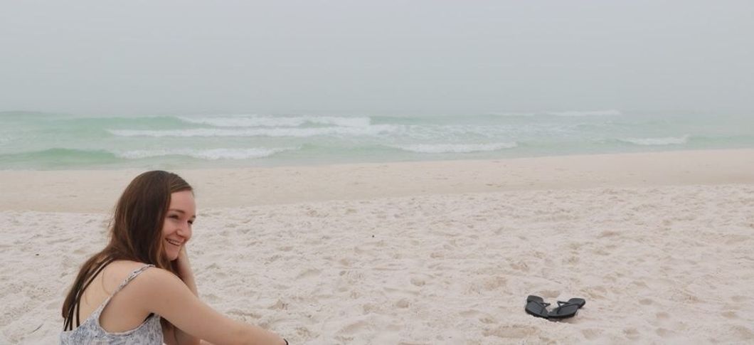 woman sitting on beach