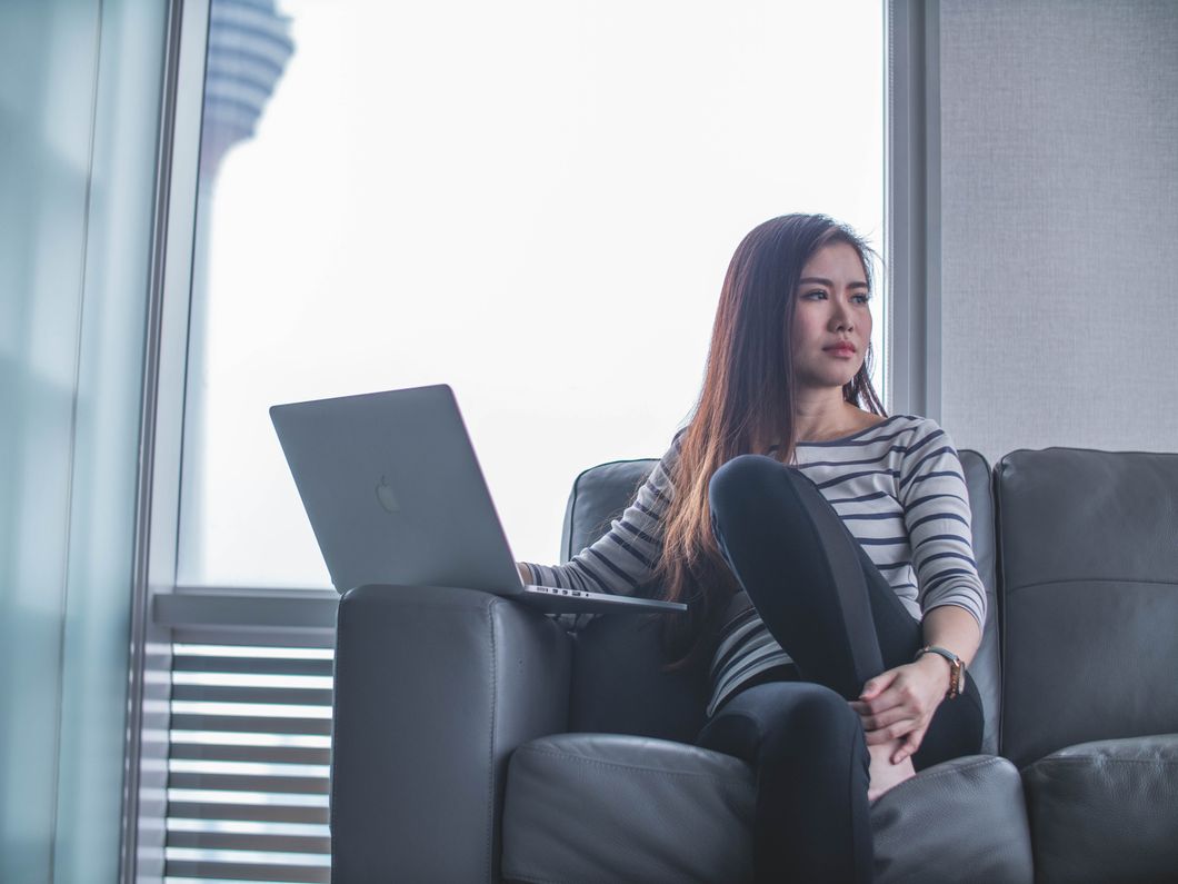 woman sitting with laptop