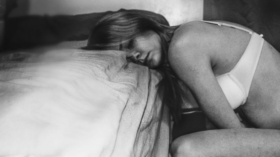 woman sleeping on bed