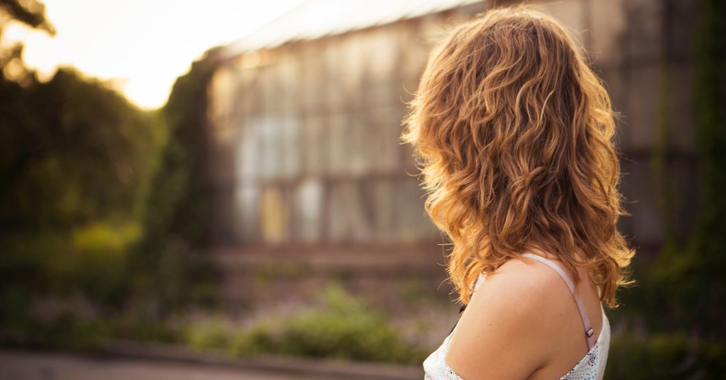 Woman staring into distance.