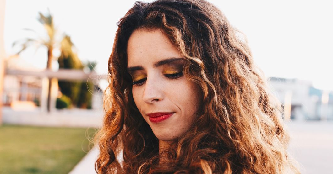 Woman wearing red lipstick.