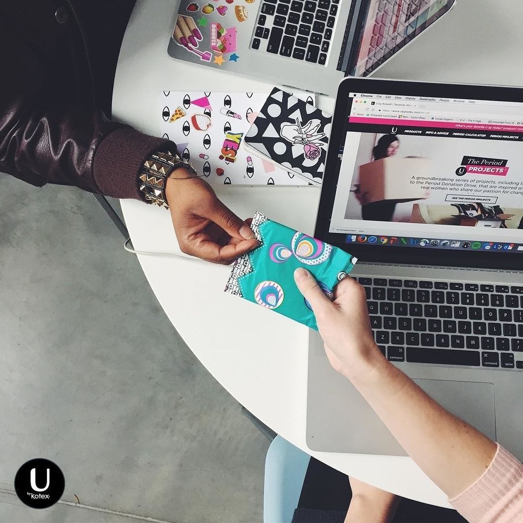 women sharing pad at office