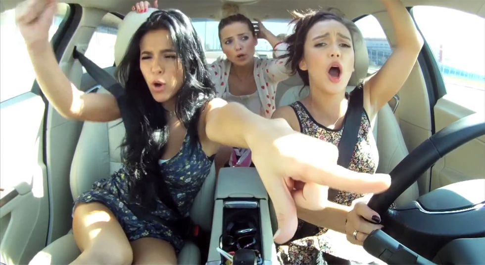 women sing greatest hits while in car on road trip