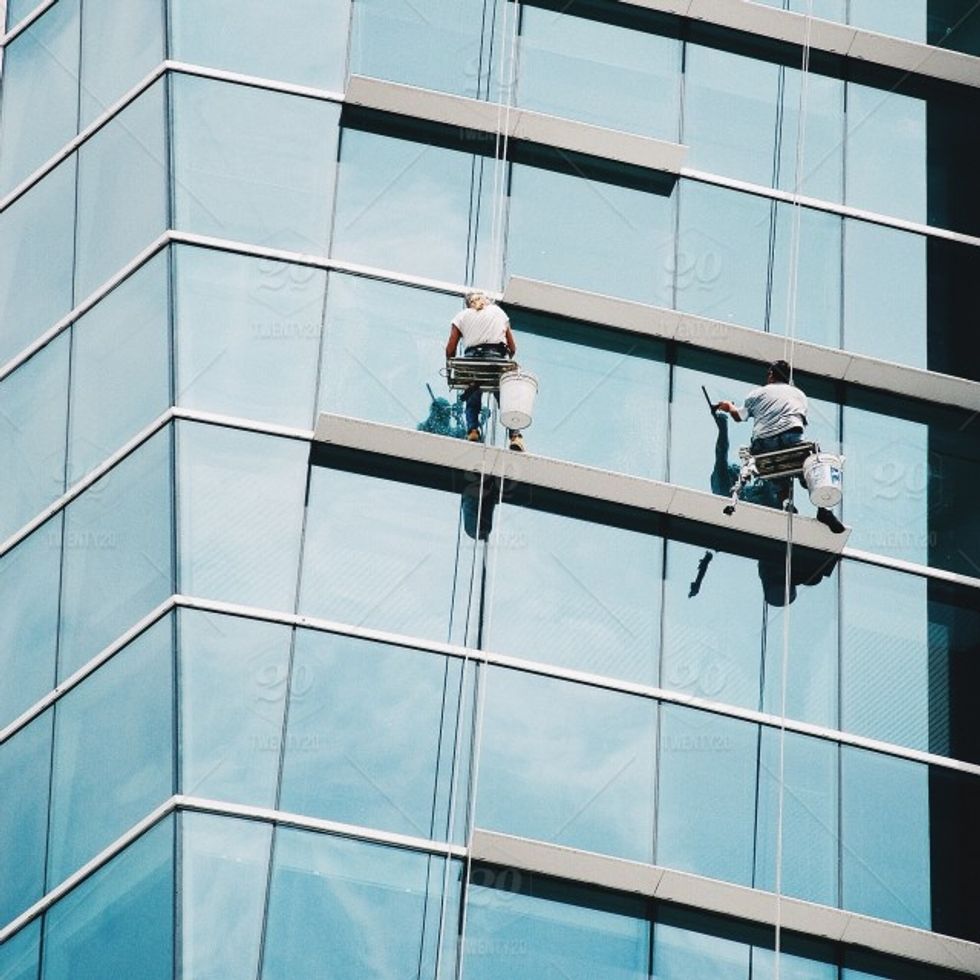 workers cleaning windows