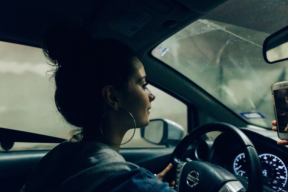 Young adult girl driving
