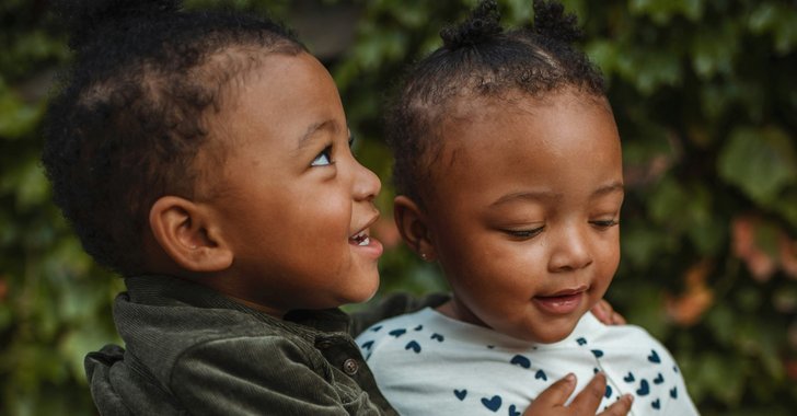 young siblings next to each other