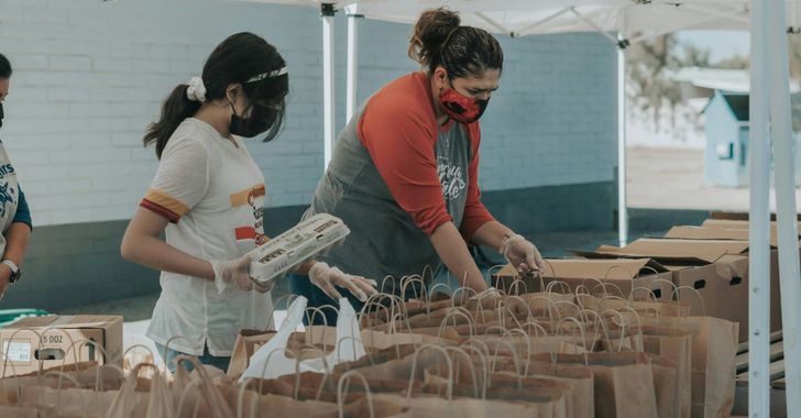 young women volunteer to help those in need